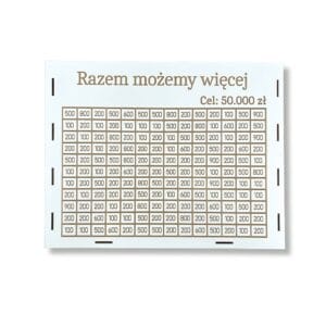 Skarbonka Gigant 154 Kafelki 50000 zł Razem Możemy Więcej z widocznym panelem frontowym zawierającym pola z kwotami i napis główny.